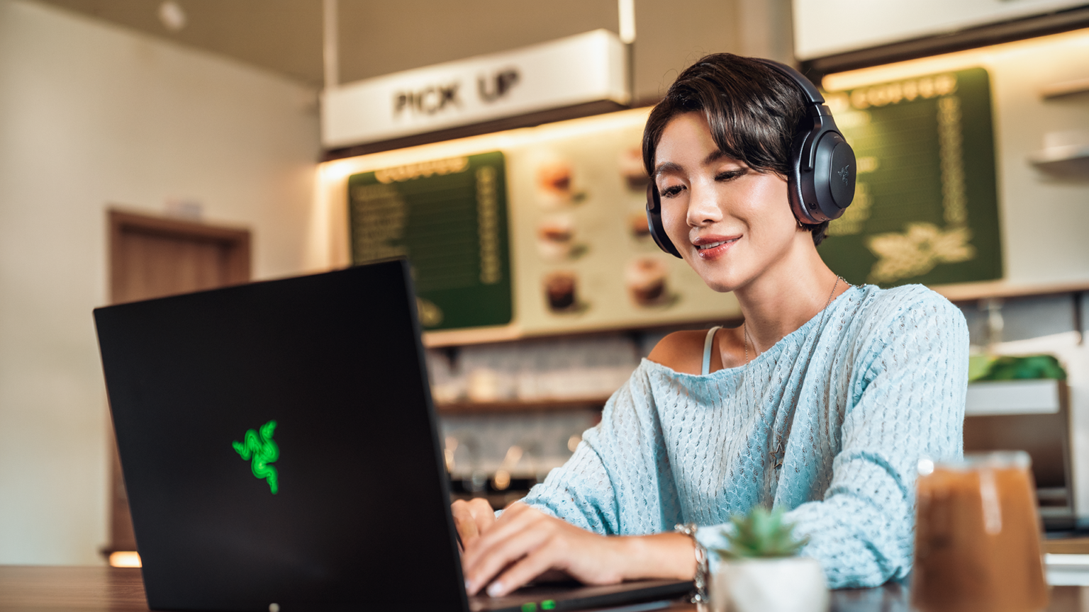 At 285 grams with a fold-flat hinge, the headset is built for travel as much as the desk. Image: Razer.